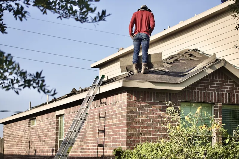 Professional roofer working on a residential roof in Amarillo